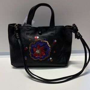 Black Leather Handbag with Floral Embellishment